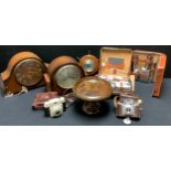 An oak mantel clock; another; a ship's wheel wall barometer; cameras; gentleman's travel sets; qty