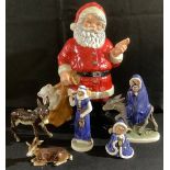 A large Goebel Weihnacht figure, Father Christmas, 35cm, printed mark; a Goebel nativity group of