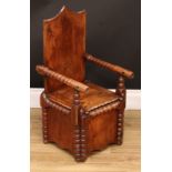 A 19th century pine child's box chair, rectangular shield shaped back, bobbin-turned arms, hinged