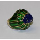A base metal dress ring, green and blue enamel, surmounted with a frog, size L