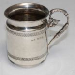 An Edwardian silver christening mug, leafy scroll handle, 7.5cm high, Birmingham 1907