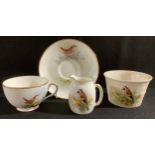 A Royal Worcester tea cup and saucer, by W Powell, signed, painted with a wren, printed mark in