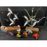 A pair of glass bird models, 25cm, wooden bases; other smaller glass models, lobster, fish, snail,