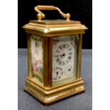 A reproduction miniature carriage clock, painted in the French manner, 7.5cm high