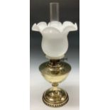 A 19th century brass oil lamp, white opaque glass fluted shade, with chimney