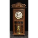 An early 20th century oak wall clock, rectangular brass plaque inscribed Presented to E.E.Ratcliff