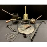 A 19th century brass revolving meat jack; a brass trivet; cast iron skillet; pans; etc
