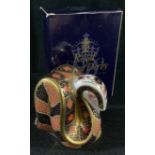 A Royal Crown Derby paperweight, Imari snake, decorated in the 1128 pattern, gold stopper, first