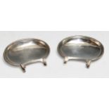 A pair of unusual Edwardian silver sweetmeat dishes, with clip mounts, 7cm long, Hilliard &
