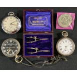 A silver open face pocket watch; an anti-reflective Luminous 8 day pocket watch; a compass set,