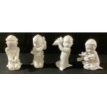 A set of four Bing and Grondahl white gloss glazed mermaids and merboys, numbers 2265, 2266, 2267
