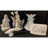 A Llardo figure group the snowman, with children and puppy, 5713, 21cm, printed mark; others,