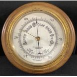 A 20th century brass barometer, James Barker and Co, Kensington, oak mount, 26cm diam
