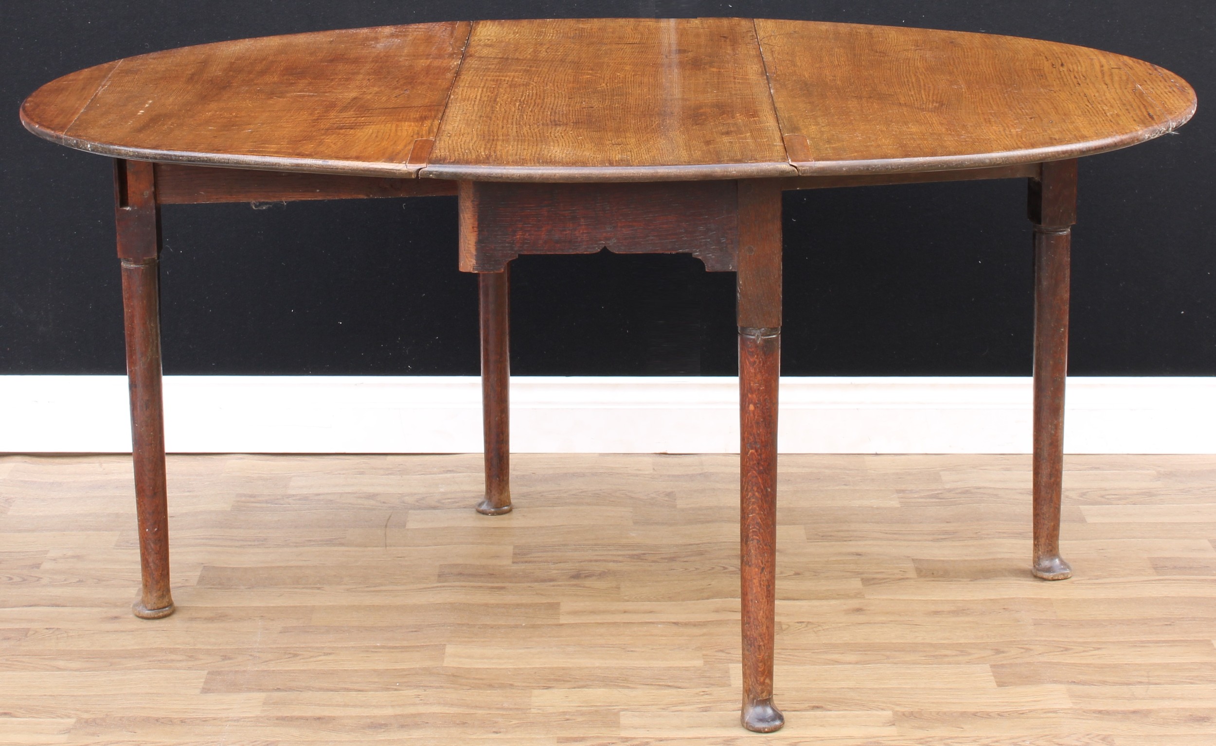 A 'George II' oak gateleg dining table, oval top with fall leaves, cylindrical legs, pad feet, - Image 3 of 3