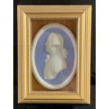 A Wedgwood Jasperware oval plaque, 18th century gent in profile, 11cm, framed in a gilt box frame,
