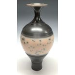 An inverted baluster studio pottery vase, glazed in bands of steel grey with a central band of