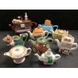 A novelty piano teapot and cover with piano stool, by Swineside Teapottery, 30cm wide; another The