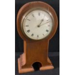 An Arts and Crafts oak mantel clock, 22cm high