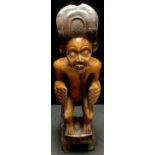 Tribal Art - a carved hardwood figure, 57cm