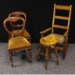 A country house ladder back rocking chair, rush seat; a similar stool; a pair of Victorian balloon