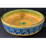 An Italian stoneware art pottery bowl by Nuovo Rinascimento, impressed and glazed in shades of