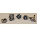 An Art Deco style base metal dress ring; four others similar (5)