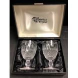 A pair of Waterford Crystal cut glass wine glasses, engraved "Bemrose & Sons 150 years Celebration",