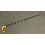 A George V 9ct gold mounted walking stick, curved horn handle, 9ct gold ferule, presented by the