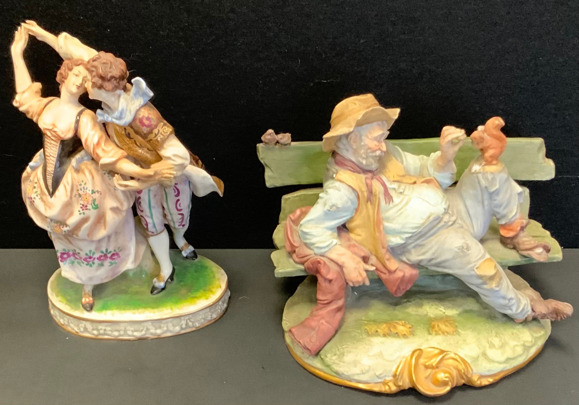 A Capodimonte figure, Dancing Companions, crowned N marks, 25cm high; another Bruno Merli, Tramp