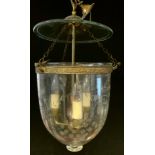 An Indian style Hundi lantern with engraved bowl, metal mounts and a three light fitment, 28cm