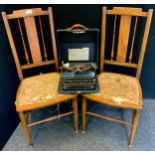 A pair of Edwardian beech salon chairs; a Remington portable typewriter model 5T, cased (3)
