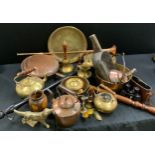 Metalware - a set of three graduated brass bells; brass warming pan; a copper kettle; a brass long