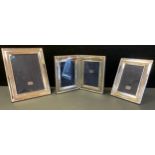 A sterling silver easel photograph frame, 22cm high; others, 18cm high; etc (3)