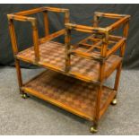 A Reproduction Oriental Style, Walnut, 'Butler's' Trolley, reeded square supports, brass ball-
