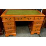 A contemporary yew writing desk, tooled leather top, 122cm wide