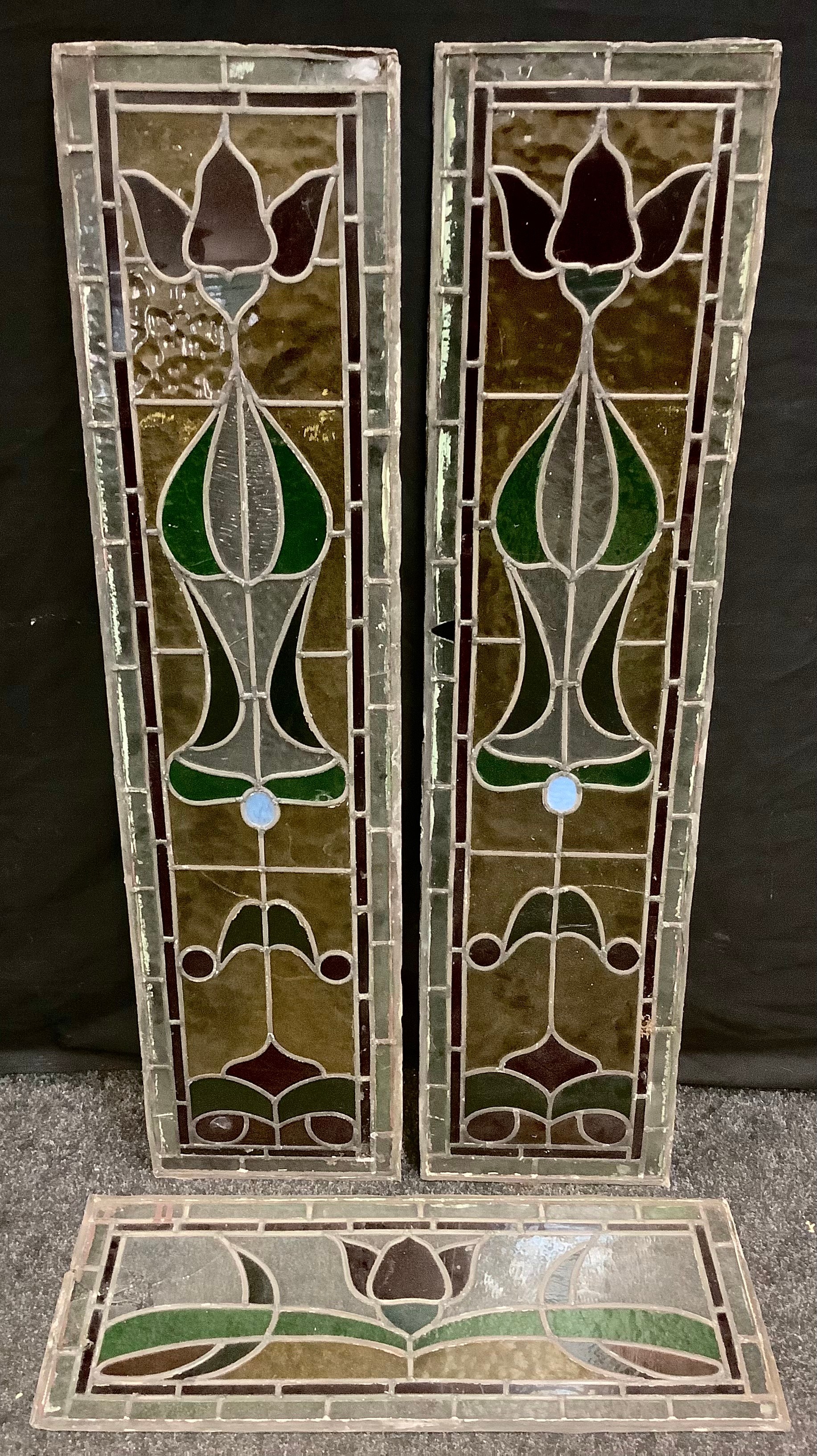 A Pair of Stained Glass Panels, with 'Art Nouveau' stylised Roses, in red, green, and yellow