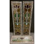 A Pair of Stained Glass Panels, with 'Art Nouveau' stylised Roses, in red, green, and yellow