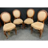 A set of four Victorian walnut dining chairs, stuffed over upholstery, cabriole legs.(4)