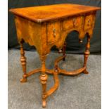 A reproduction walnut lowboy, rectangular top above one short and two deep cockbeaded drawers,