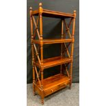 A Reproduction Mahogany Bookcase of small proportions, turned columns and x-frame stretchers,