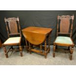 A pair of Late Victorian oak chairs, the tops carved with stylised spiral leaves, bergere back,