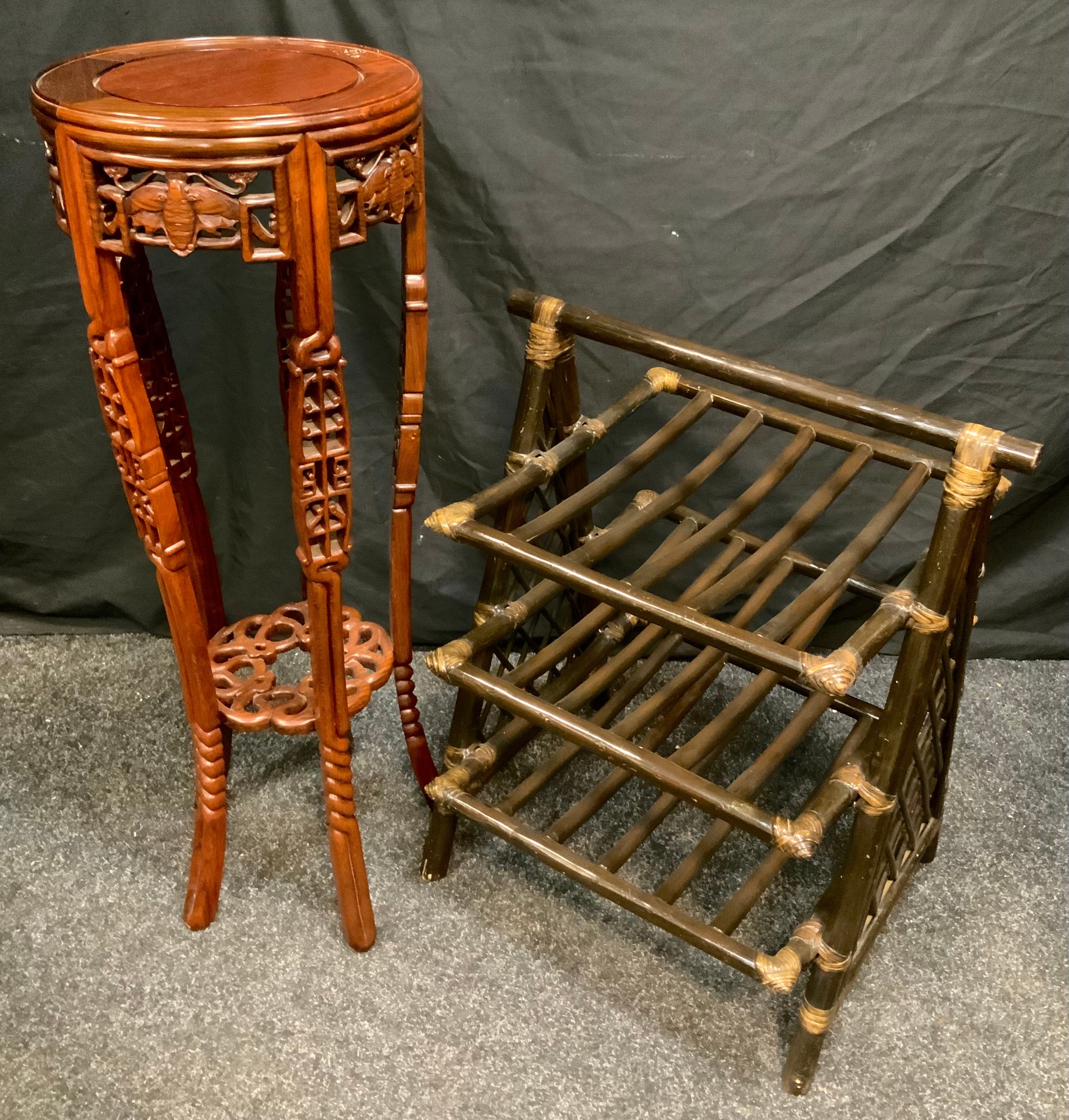 A 20th century Oriental style Mahogany Torchere/pot stand, with chinoiserie carved decoration,