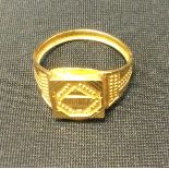 A Egyptian yellow gold ring, tested as approx 18ct gold, 3.2g