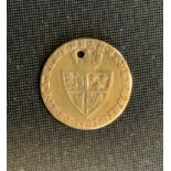 A George III spade guinea coin, drilled and worn, 1797, 2.4g gross
