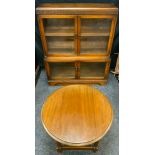 An oak and glazed bookcase, 88cm wide, c.1930; an oak circular coffee table (2)