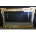 A Neoclassical style rectangular wall mirror, crossed bevelled plate, shaped floral frame, 107cm x