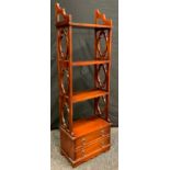 A Reproduction Mahogany floor standing or Wall Mountable bookshelf, three short shelves above a pair