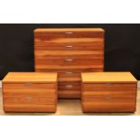 A suite of three contemporary figured and flat sawn black walnut and veneer chests, comprising a