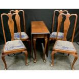 A 20th century oak drop-leaf table, rounded rectangular top, cabriole legs, 77cm high, 150cm long,