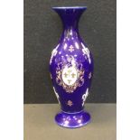 A Keller & Guerin, Luneville slender baluster vase, with raised oval crested cartouche, the cobalt